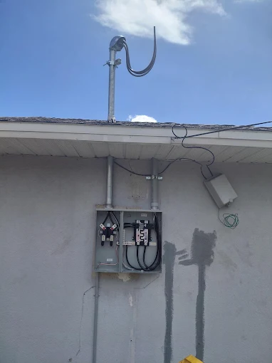 Exterior electrical service equipment and meter on a building wall