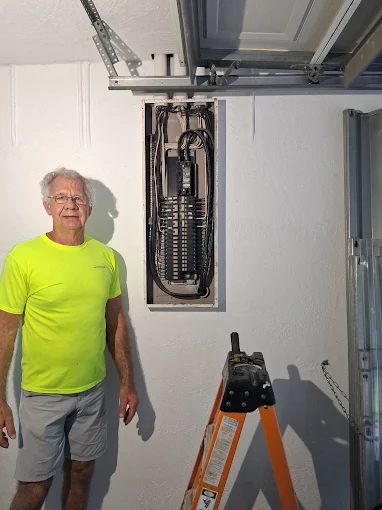 Modern residential electrical breaker panel with organized circuit wiring