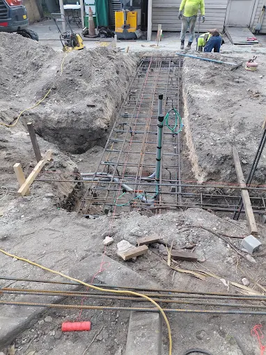 Conduit roughed in through rebar before a concrete slab pour